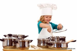 Child Chef 6 Happy chef girl stirring soup in a bowl